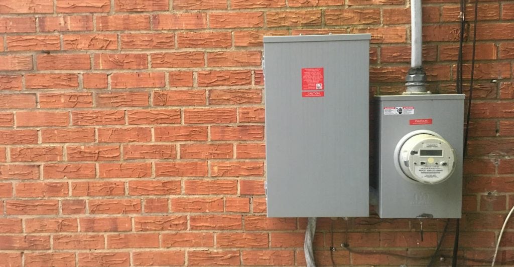 electric meter on brick wall